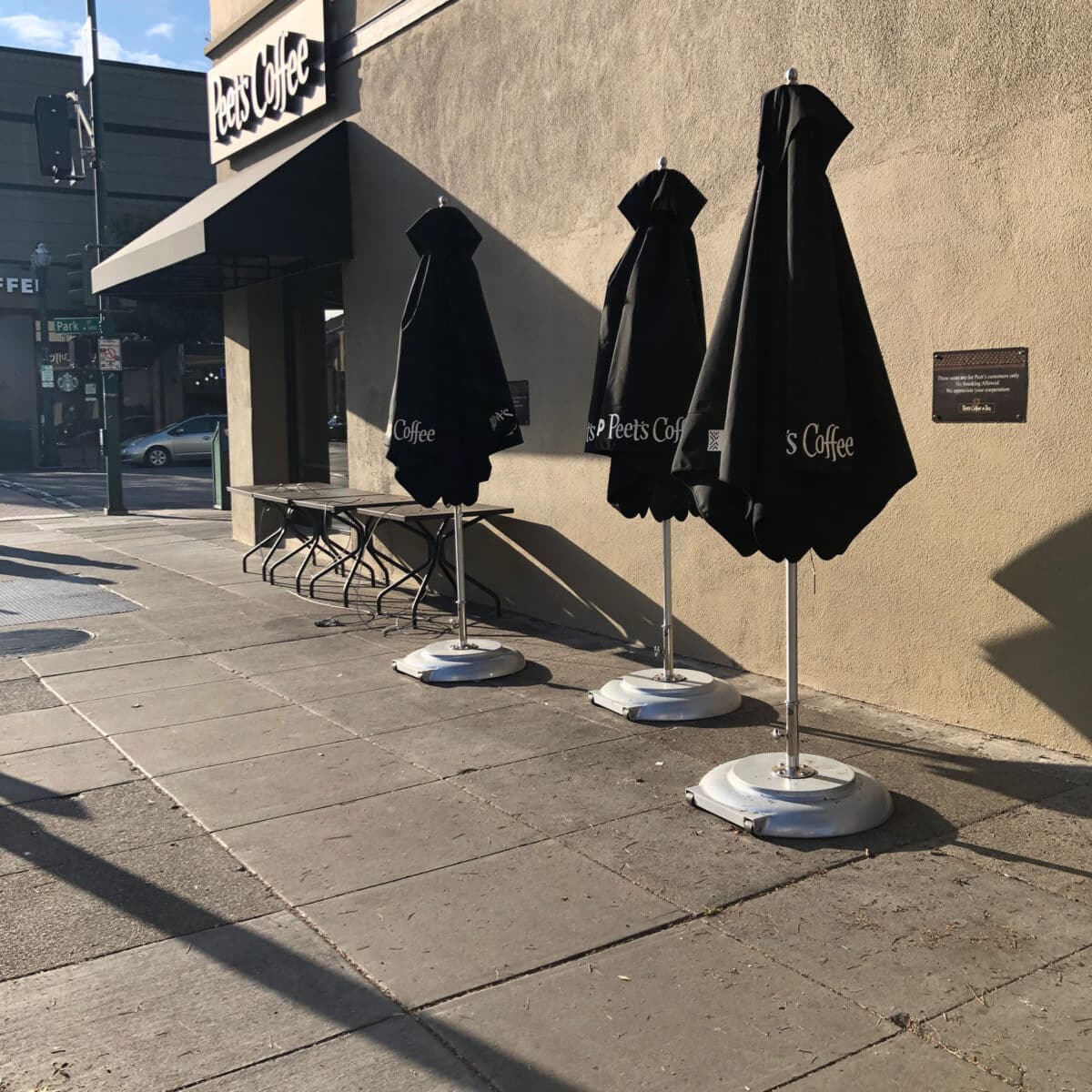 Alameda Post - The outside of Peet's on park street. The umbrellas are closed and no chairs are out.
