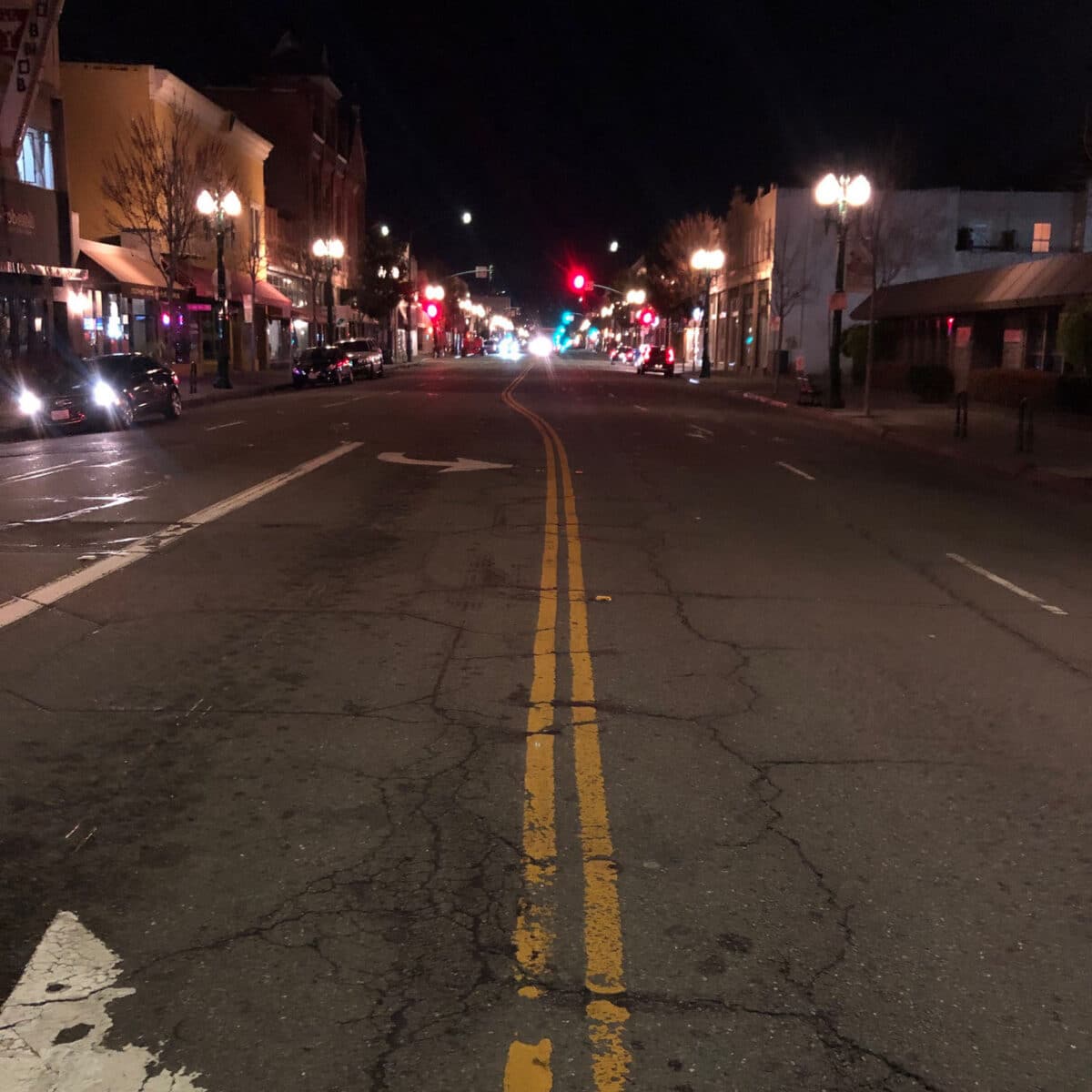 Alameda Post - An empty park street at night. 