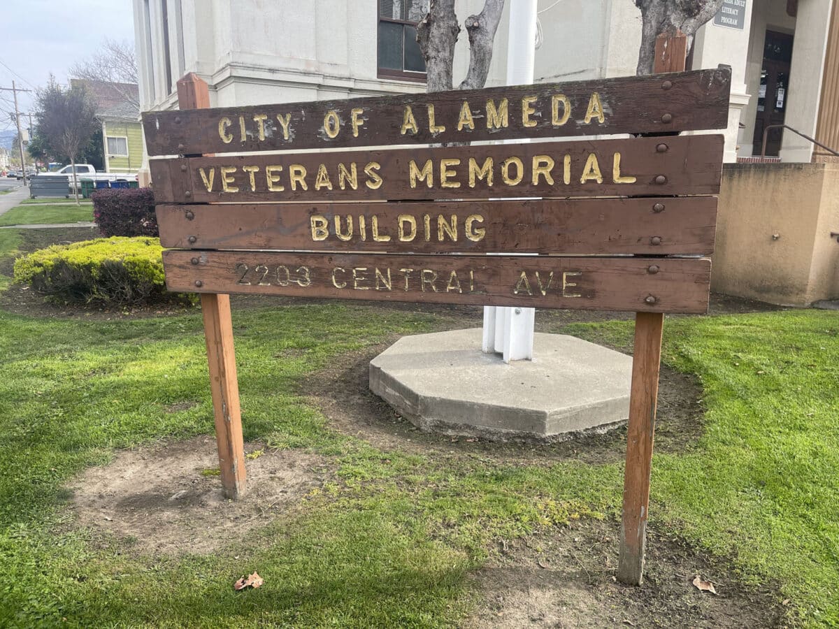 Alameda Post - A fading sign in front of the Veterans Memorial Building. 