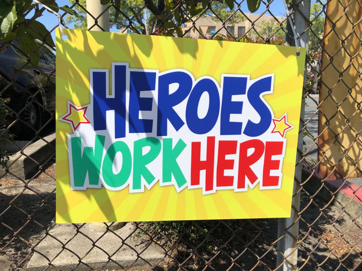 Alameda Post - A sign that says "Heroes work here"