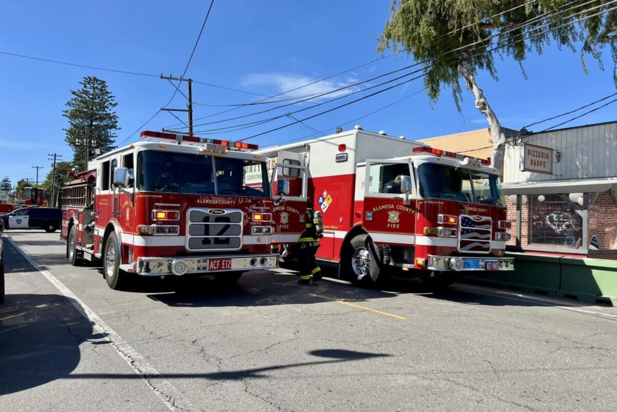 Fire trucks block the street. 