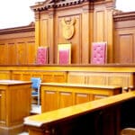 Alameda Post - A courtroom with wood paneling.