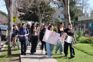 Alameda Post - students march with protest signs.
