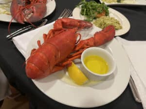 Alameda Post - A lobster dinner on a plate.