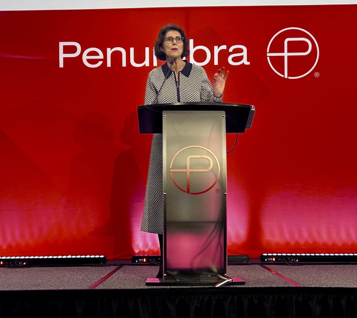 Alameda Post - Marilyn Ezzy Ashcraft stands behind a podium and talks at the State of the City address.