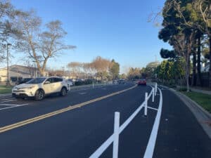 Alameda Post - A newly remodeled Aughinbaugh Way featuring plastic posts separating a bike lane.