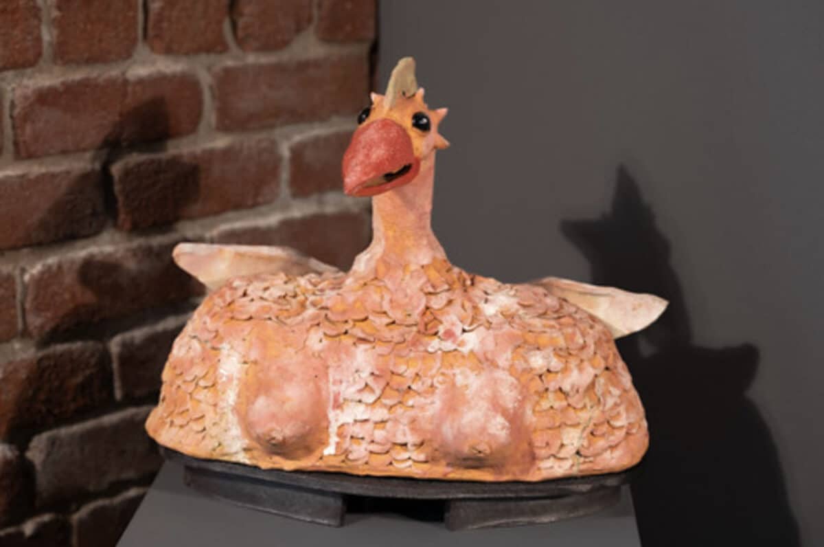 Alameda Post - A sculpture bust of a chicken with breasts.