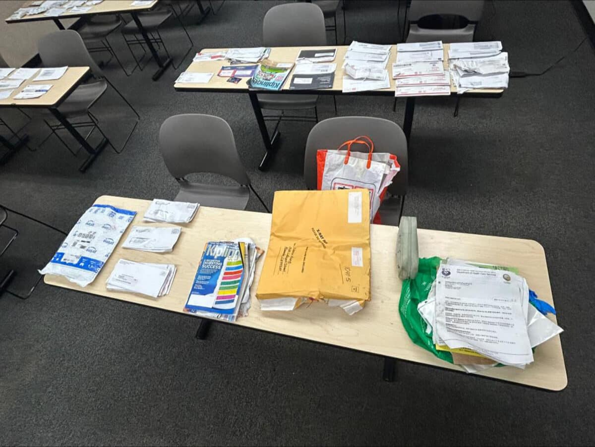 Alameda Post - tables covered in mail and packages.