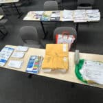 Alameda Post - tables covered in mail and packages.