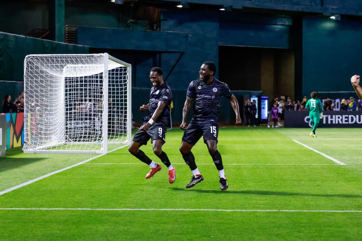 Alameda Post - Two Roots players celebrate together in the game against Mexico United. 