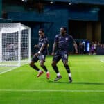 Alameda Post - Two Roots players celebrate together in the game against Mexico United.