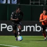 Alameda Post - An Oakland Roots player dribbles the ball in a match against Orange County SC.