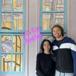 Alameda Post - a smiling couple inside a backdrop at Doodlecakes.