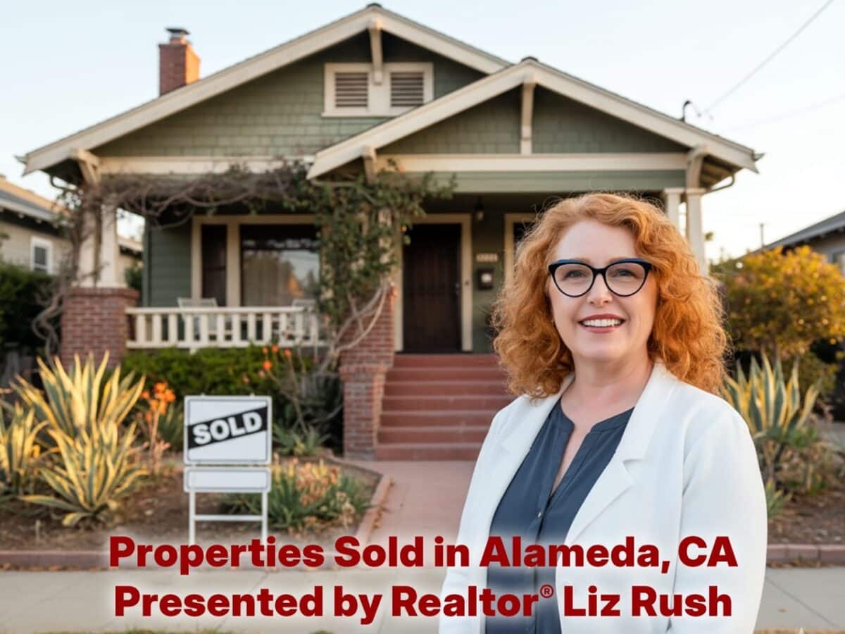 Alameda Post - A red haired woman smiles in front of a home that has a sold sign in the yard.