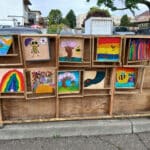 Alameda Post - A gallery wall in Webster Park of small artworks.