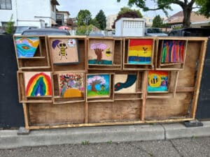 Alameda Post - A gallery wall in Webster Park of small artworks.