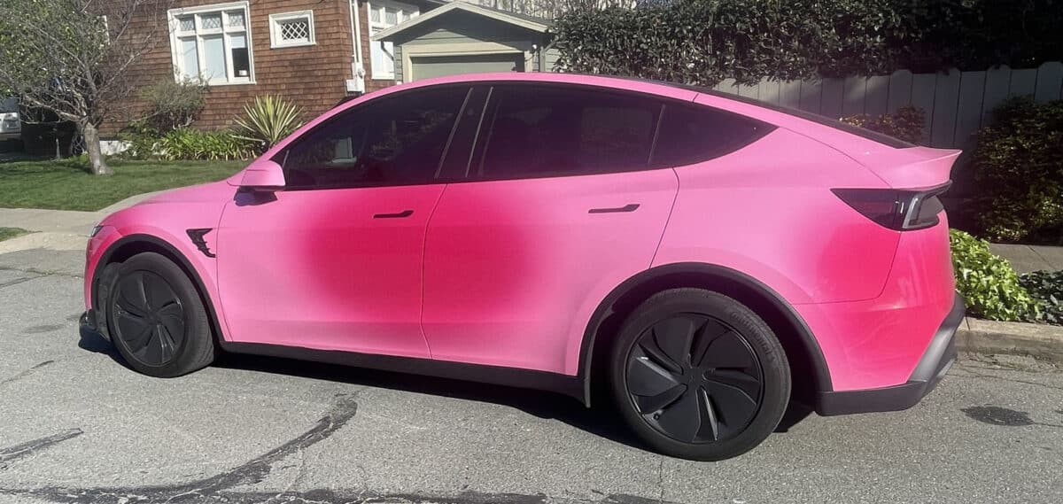 Alameda Post - A pink or red tesla.