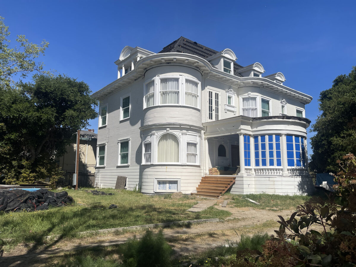 Alameda Post - A large, white house that's under restoration. 