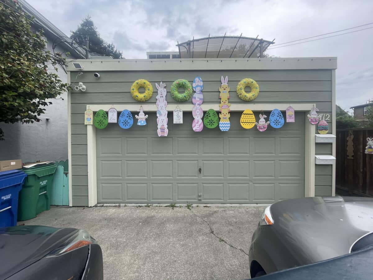 Alameda Post - Easter decorations and party streamers hanging from a garage.