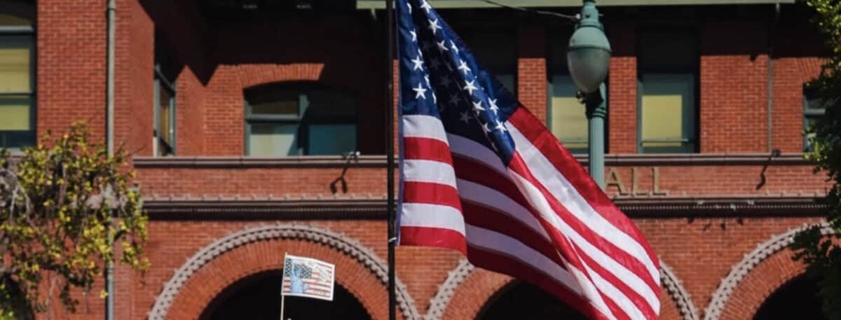 Alameda Post - An American flag in front of Alameda City Hall.