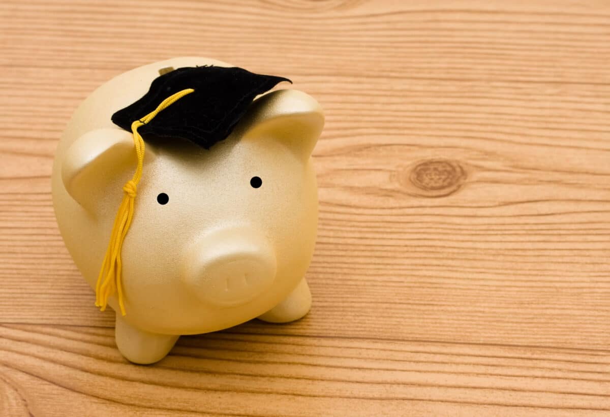 Alameda Post - A piggy bank with a graduation cap.