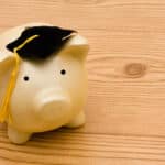 Alameda Post - A piggy bank with a graduation cap.