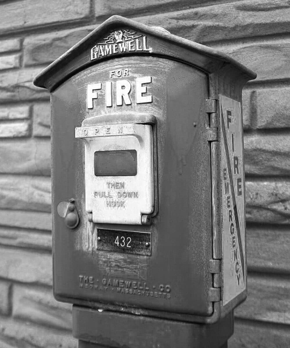 Alameda Post - A black and white photo of a fire alarm call box. 