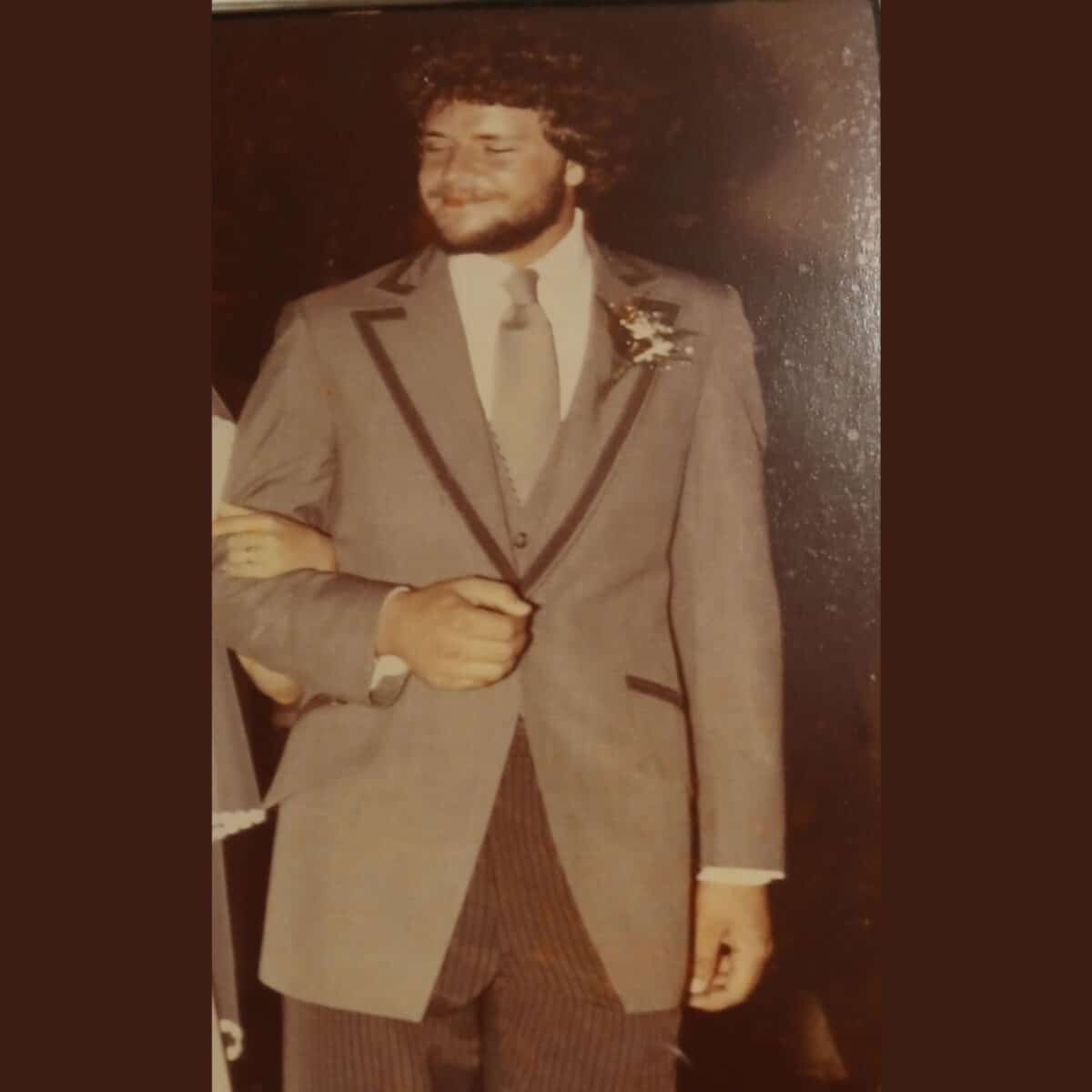 Alameda Post - a bearded young man in a suit