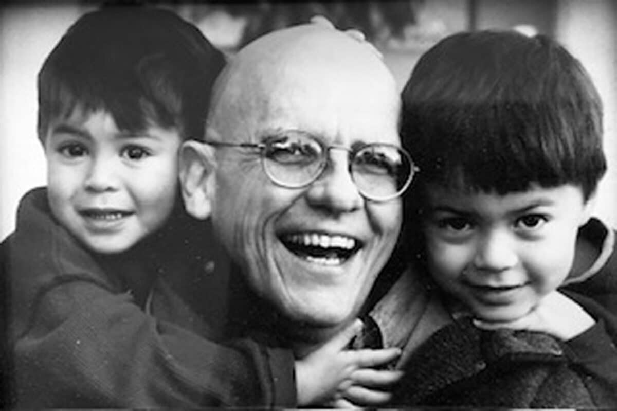 Alameda Post - A bald man smiling with two children. 