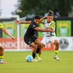 Alameda Post - Oakand Roots players dribble the ball against Tampa Bay Rowdies.