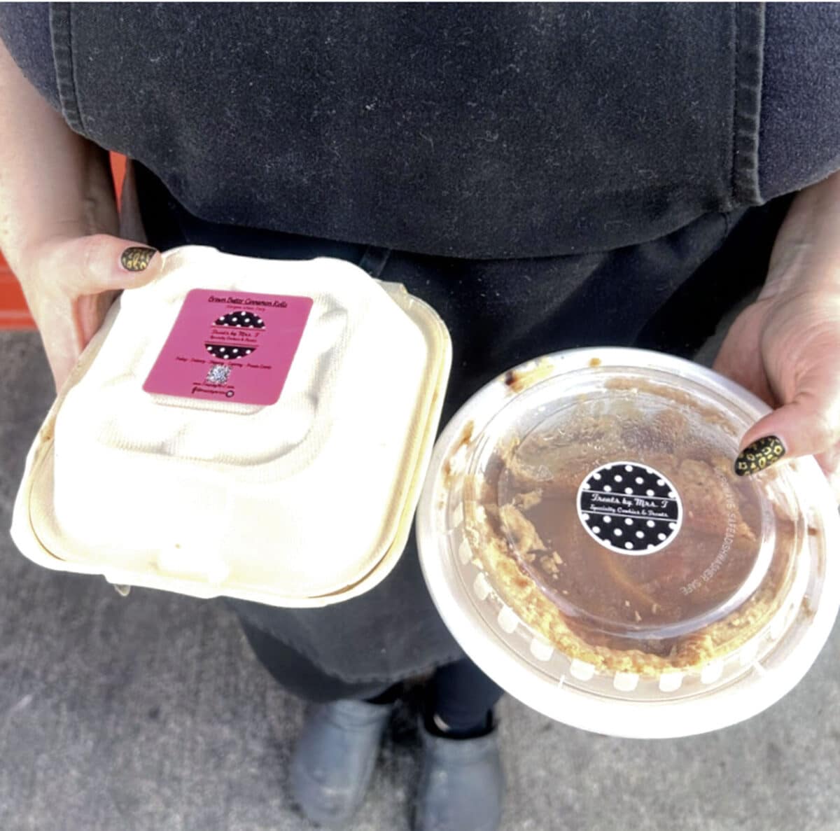 Alameda Post - A woman holds two containers of desserts. 