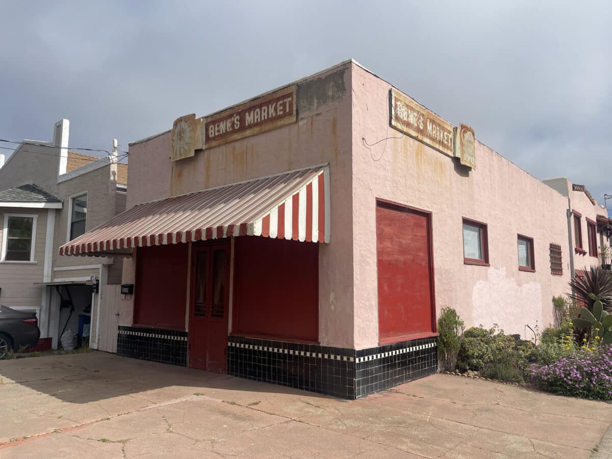 Alameda Post - An old one story building that appears no longer in use with a striped red and white awning. It says "Bene's Market" on the side.
