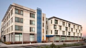 Alameda Post - A four story, large apartment building.