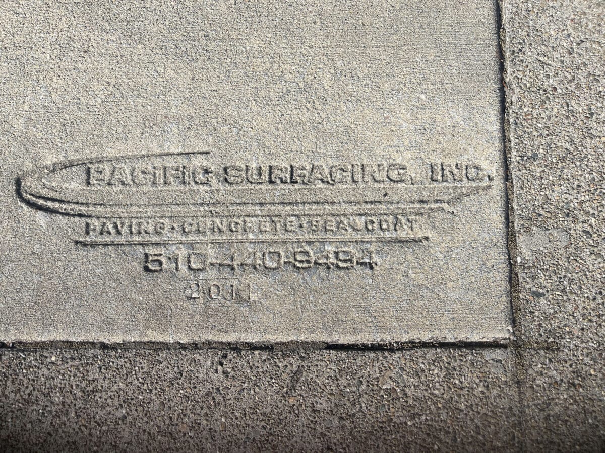 Alameda Post - A stamped sidewalk brand with lots of brand information.