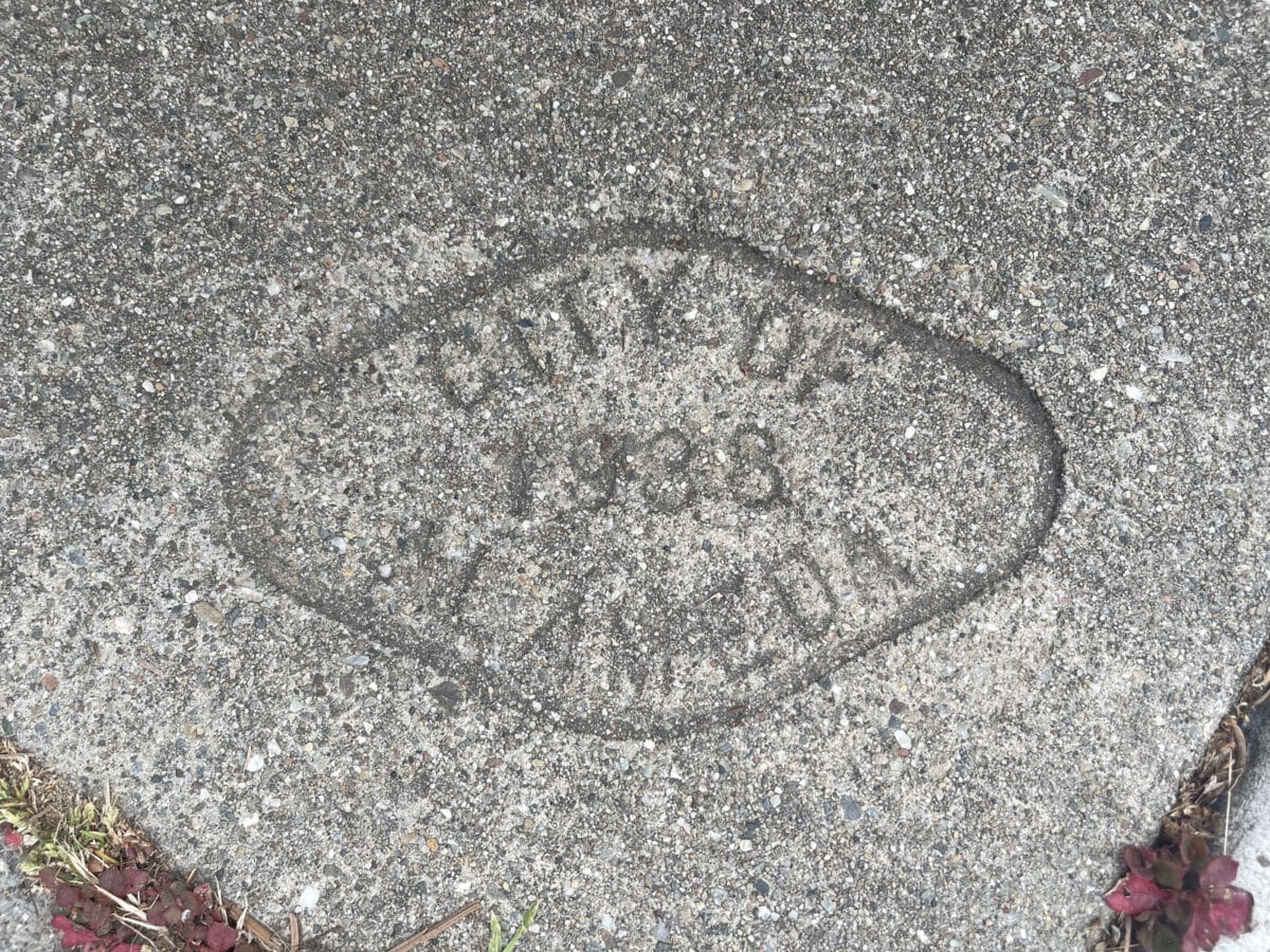 Alameda Post - A stamped sidewalk brand from 1938 that says City of Alameda.