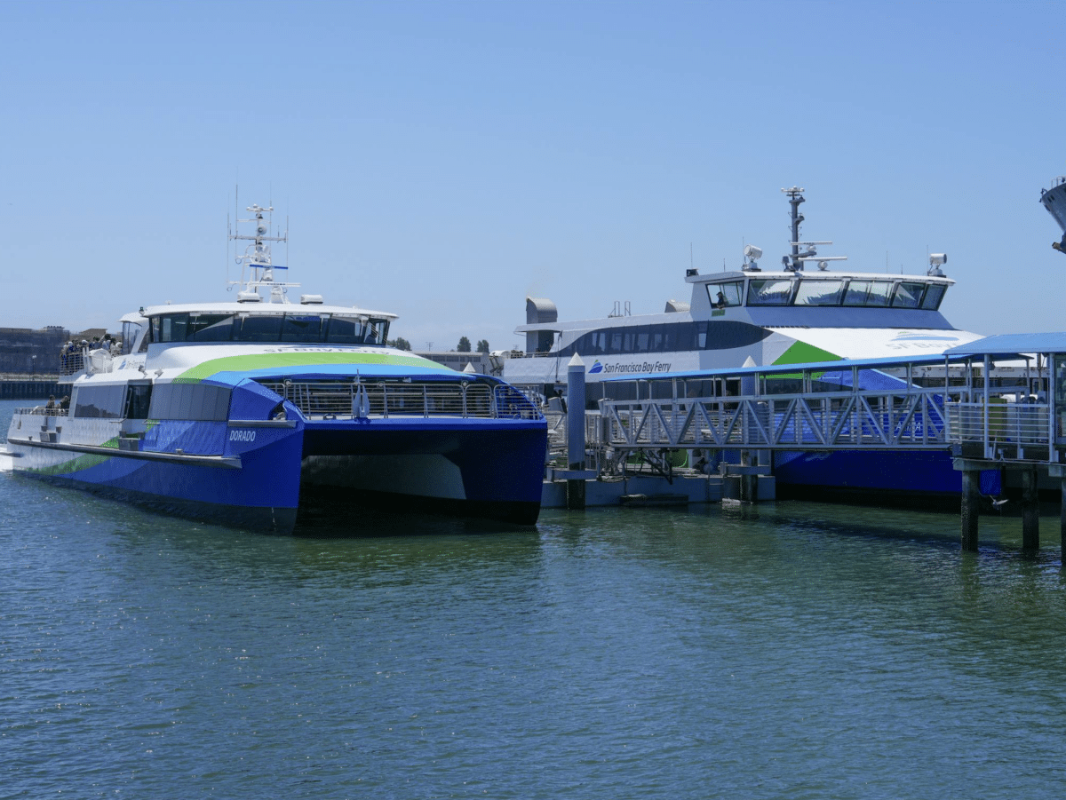 Alameda Post - Two S.F. Bay ferries at a dock. 