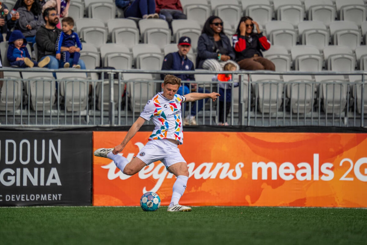 Alameda Post - An Oakland Roots player kicks the ball in a match against Loudoun United FC.