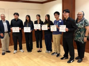 Alameda Post - Kiwanis scholarship recipients smile and pose with certificates.