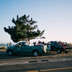 Alameda Post - Two East Bay Regional Parks District vehicles parked on the beach next to police officers.