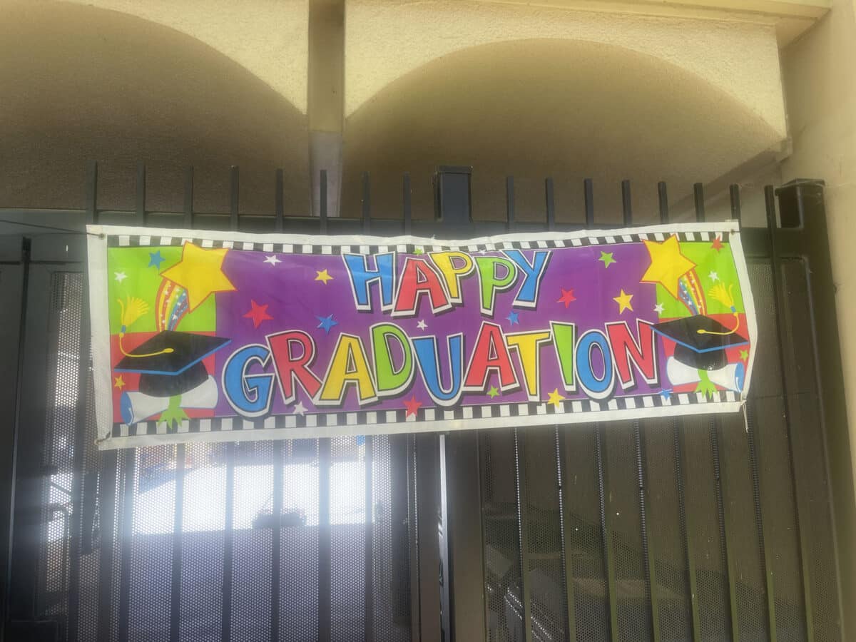 Alameda Post - A colorful Happy Graduation sign.