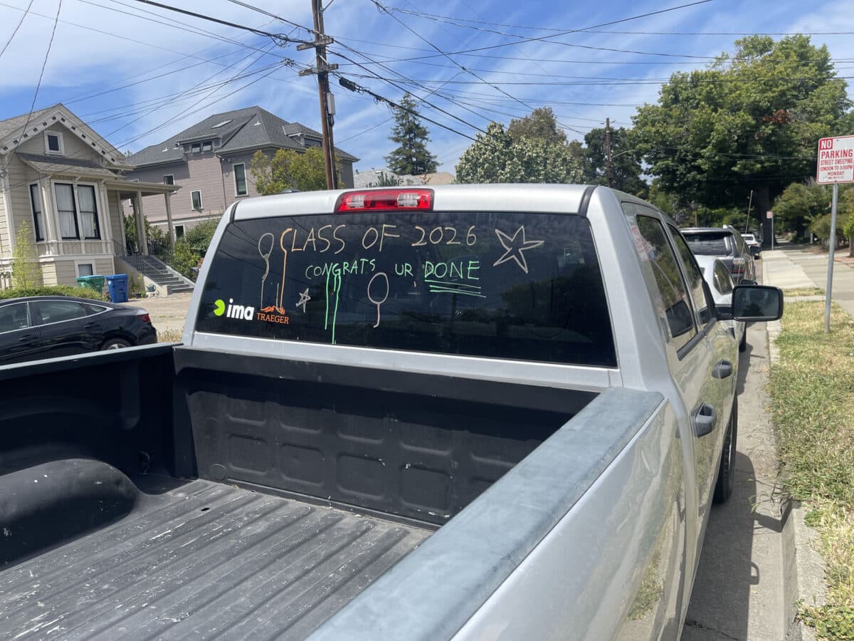 Alameda Post - Writing on the back window of a pickup truck that says Class of 2026 Congrats you're done.