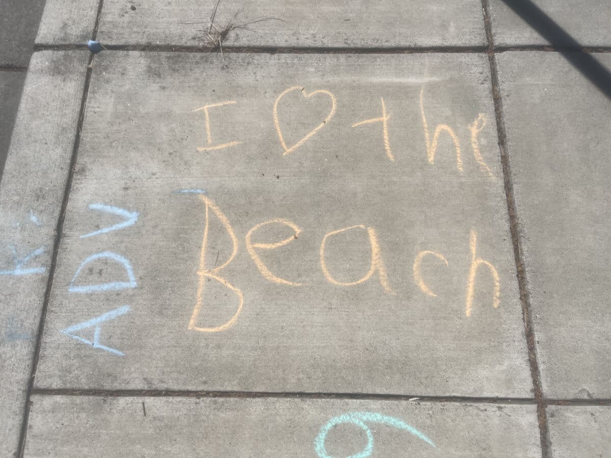 Alameda Post - Sidewalk chalk that says I heart the beach. 