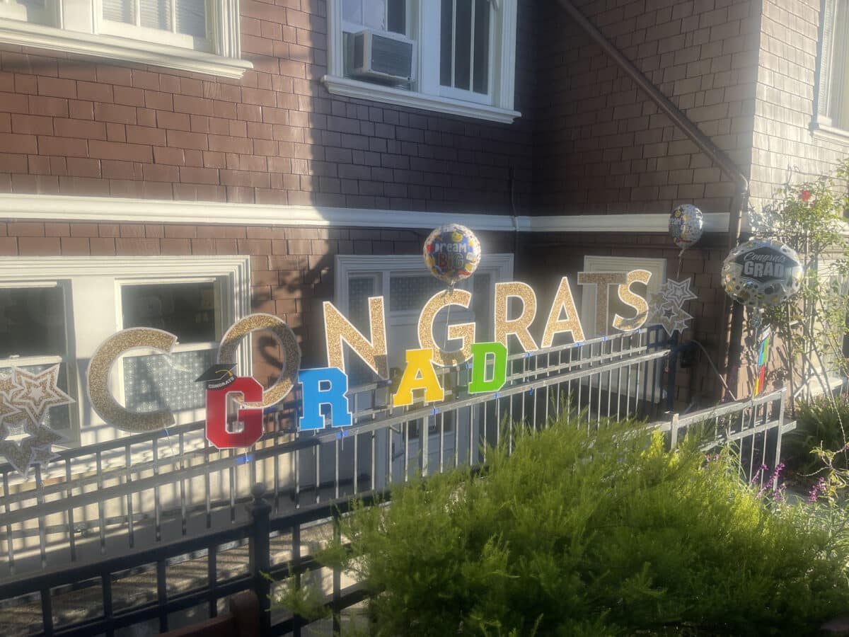Alameda Post - Letter signs outside of a home that says Congrats Grad. 