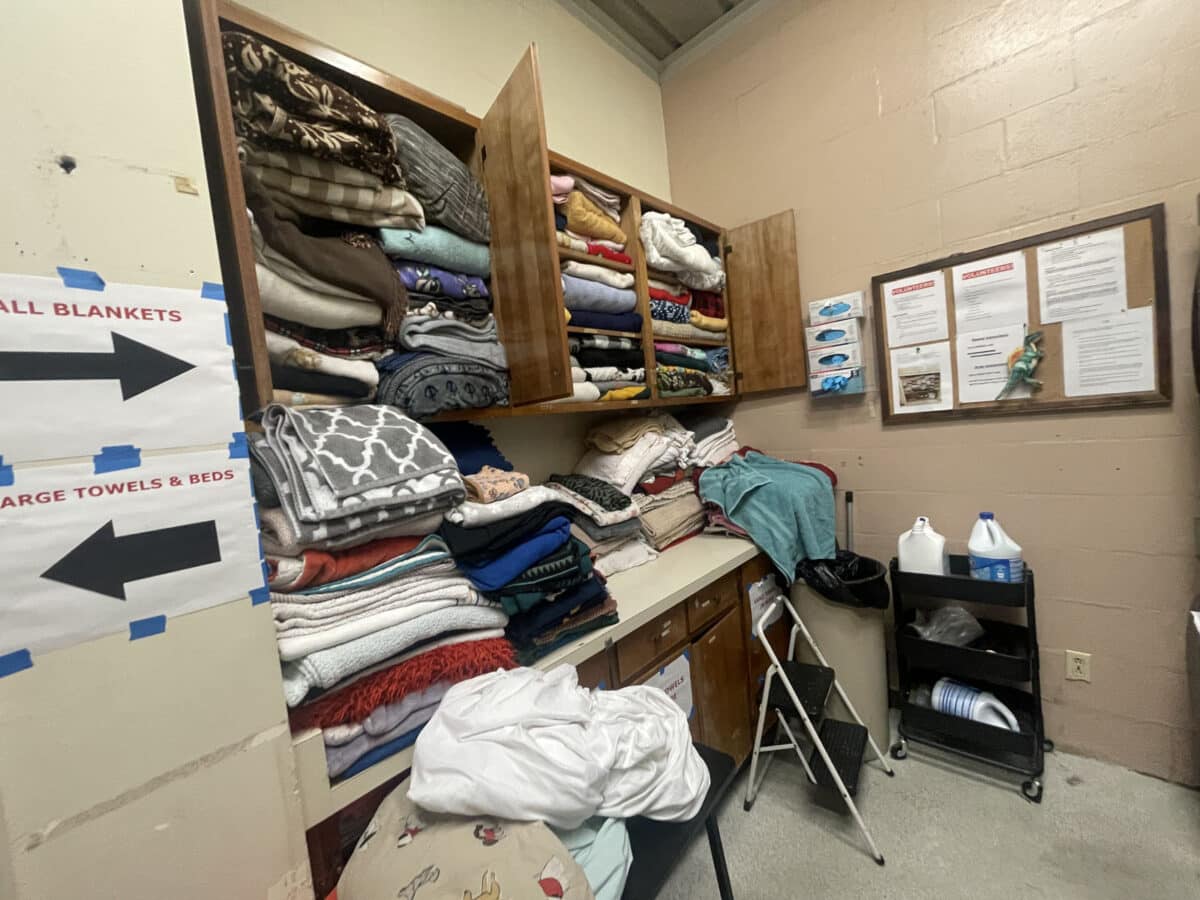 Alameda Post - Overflowing cabinets full of folded laundry. 