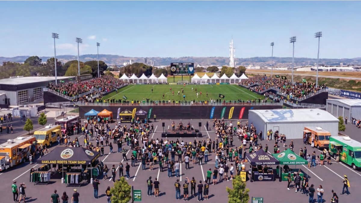 Alameda Post - A render of a soccer field and crowd attending match on Bay Farm Island. 