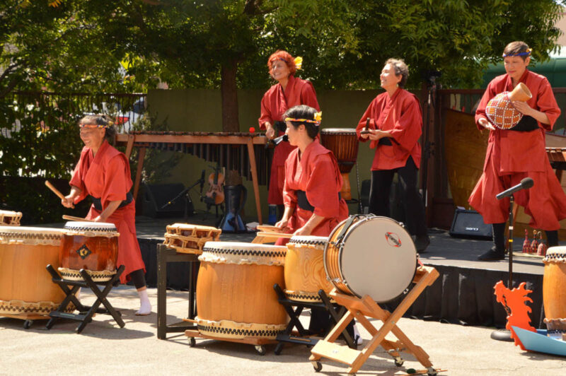 Alameda Post - Maze Diako plays percussion instruments in making robes.