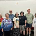 Alameda Post - A group photo of seven smiling people of various ages.