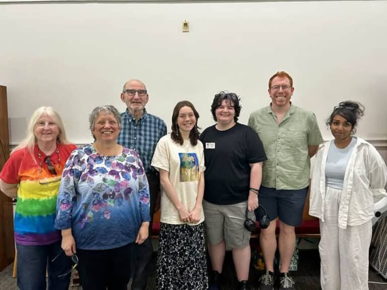 Alameda Post - A group photo of seven smiling people of various ages.