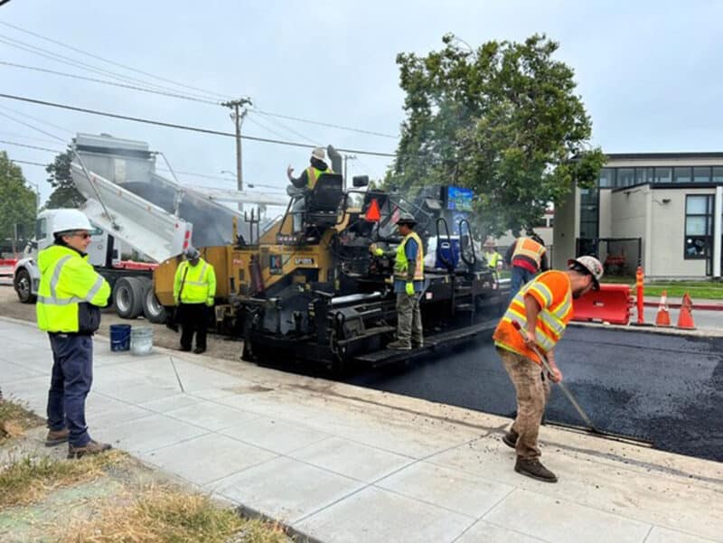 Alameda Post - A construction crew works to pave a road.