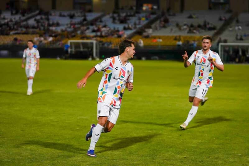Alameda Post - Three Oakland Roots players together on the field during the match against the Las Vegas Lights.